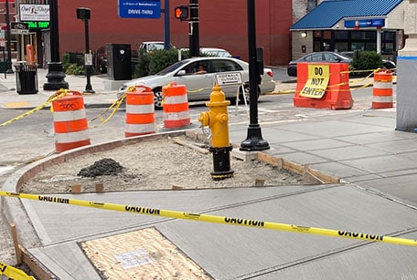sidewalk construction with traffic cones