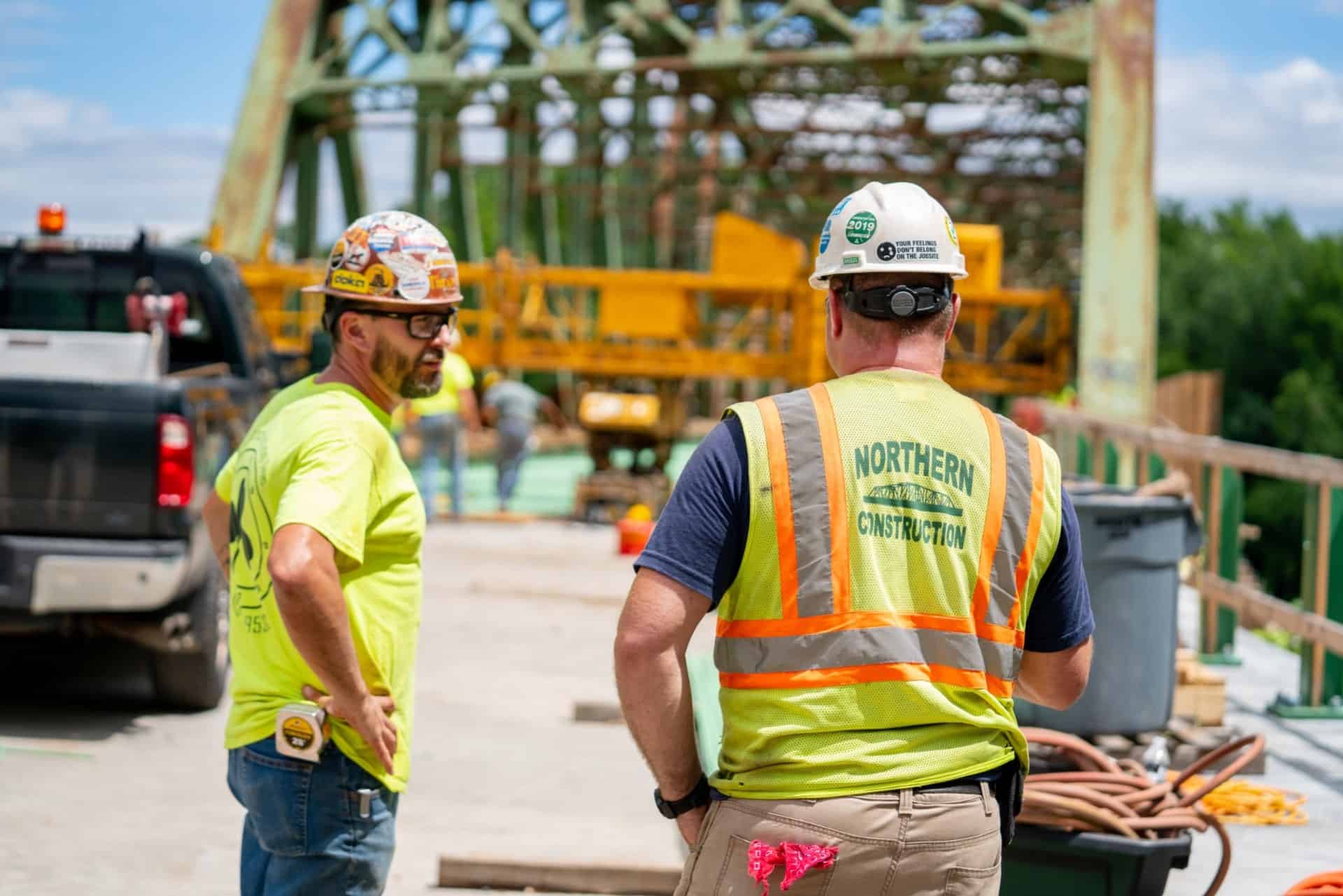 Two Northern Construction worker on a bridge